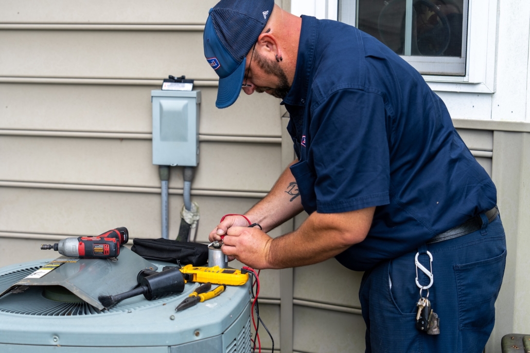 Burch technician maintaining an HVAC unit
