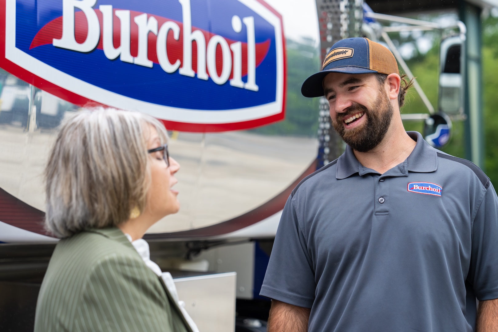 Burch worker smiling with a community member