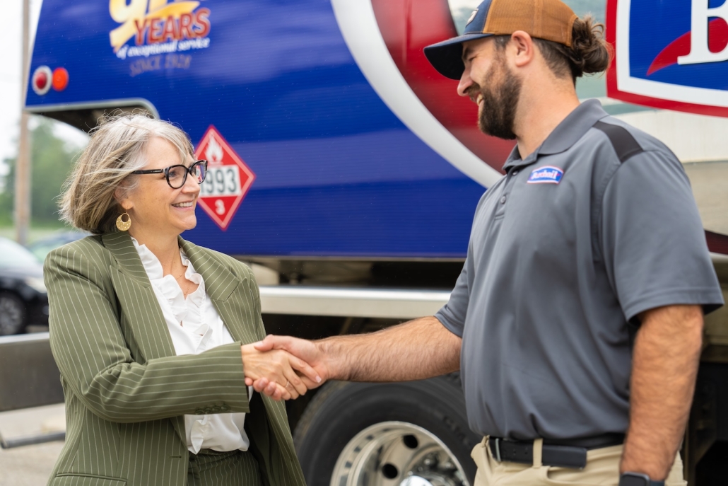 Burch technician shaking hands with a customer
