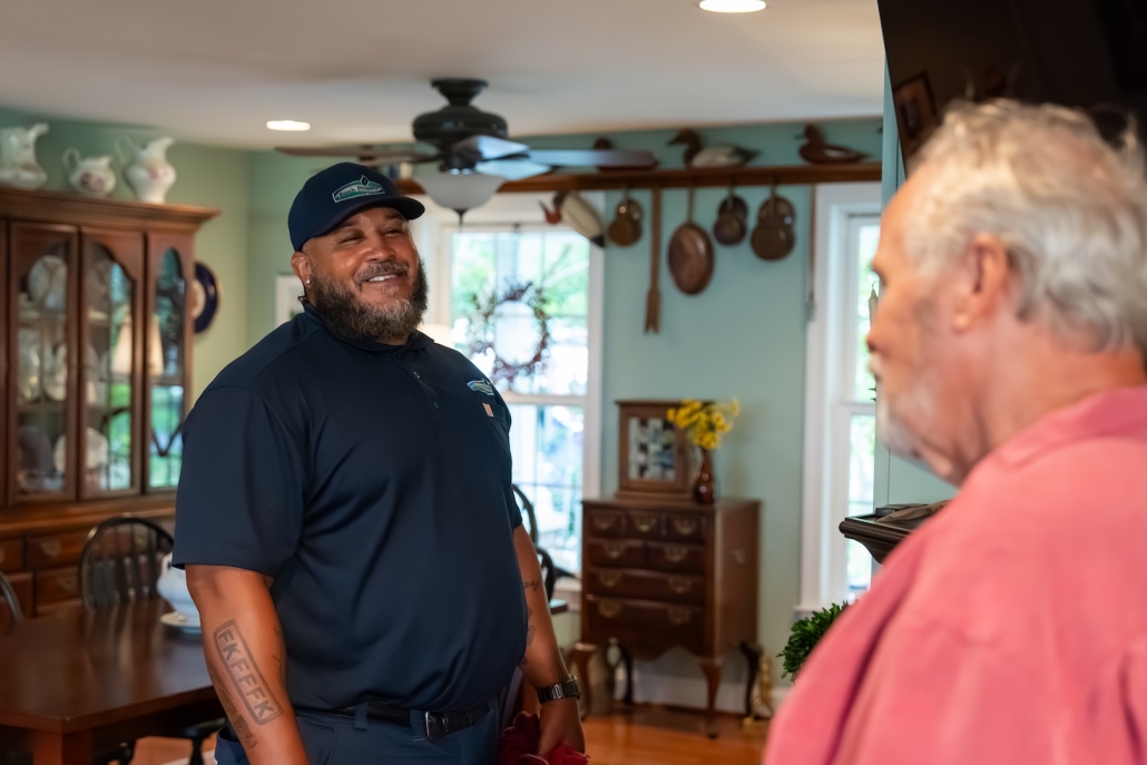 Burch technician speaking to customer.