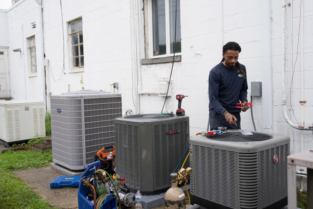 Burch technician maintaining AC units and heat pumps