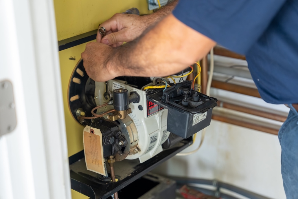 Burch worker maintaining a boiler system