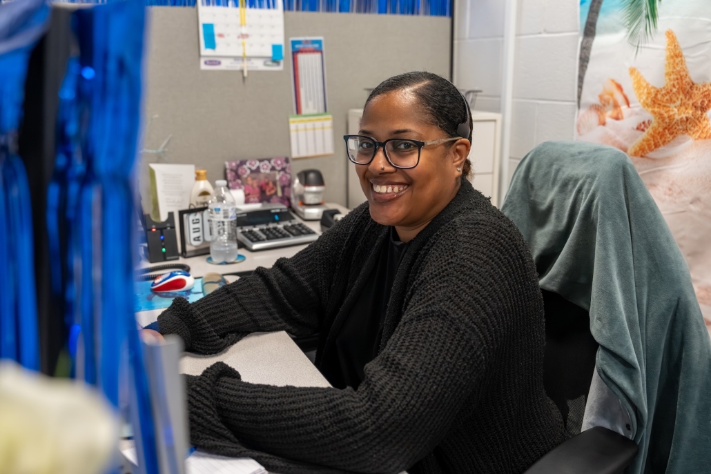 Burch employee smiling at a desk