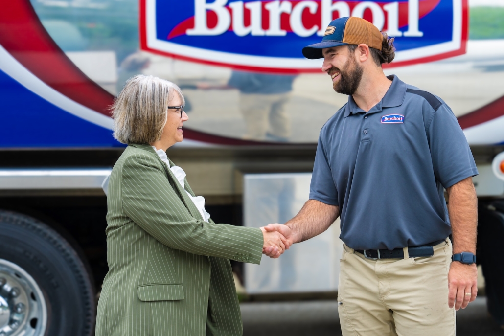 Burch technician shaking hands with customer after discussing their HVAC, propane and heating oil needs.