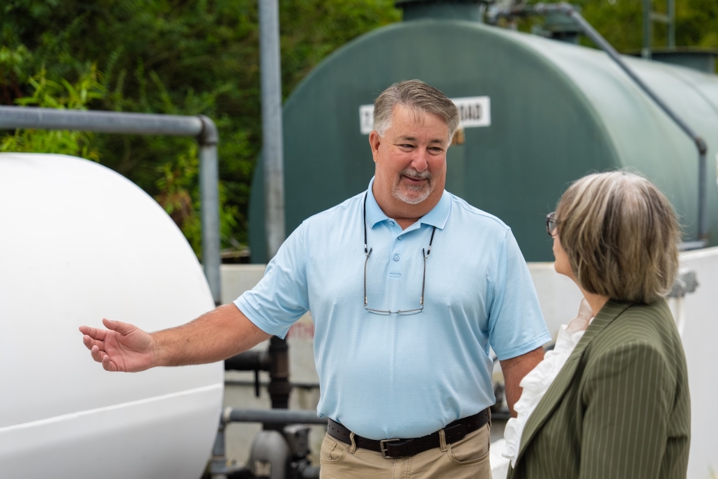 Burch employee talking with customer about HVAC, propane and heating oil needs.